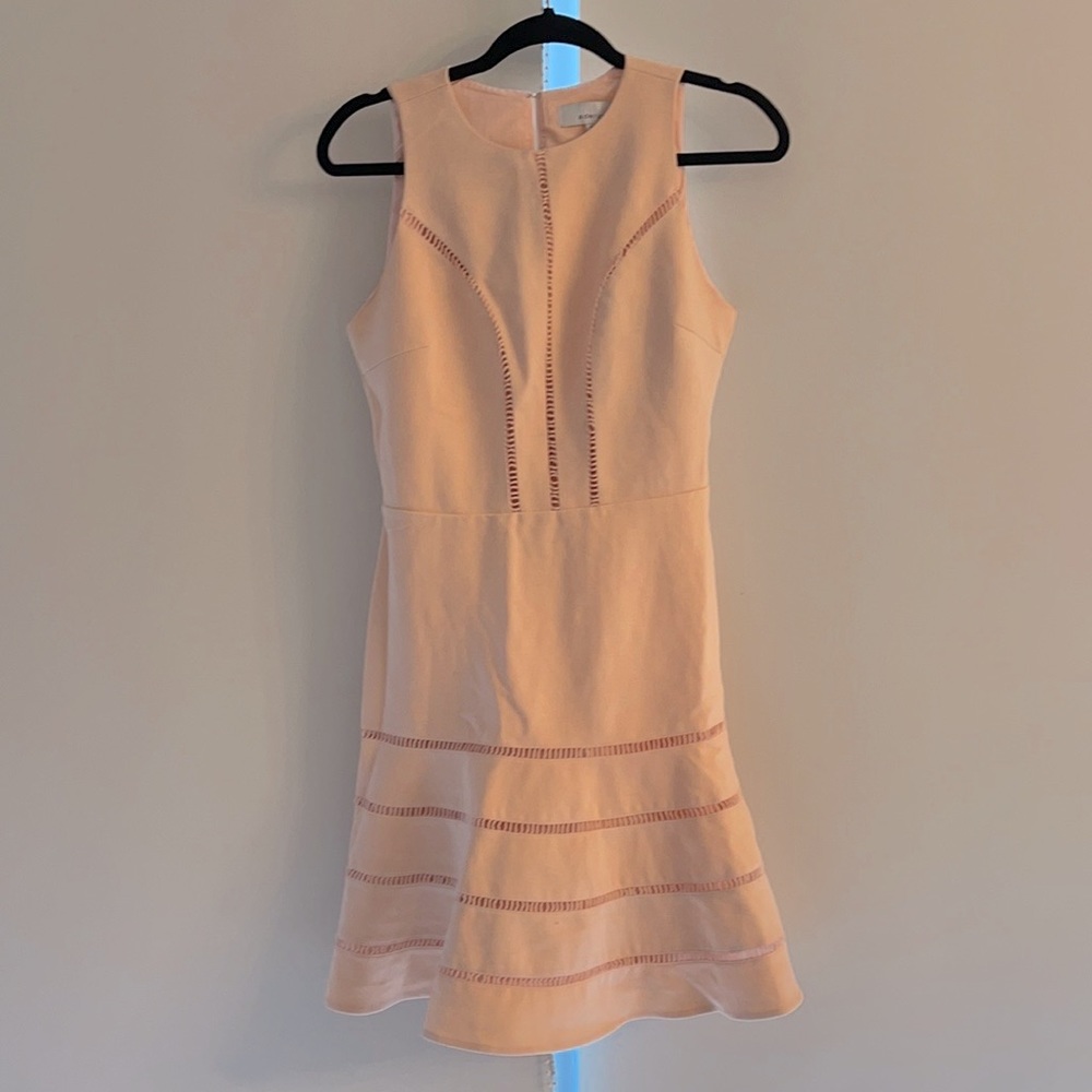 Peach sleeveless Dress with hook stitching. Fit and flare. Never worn!